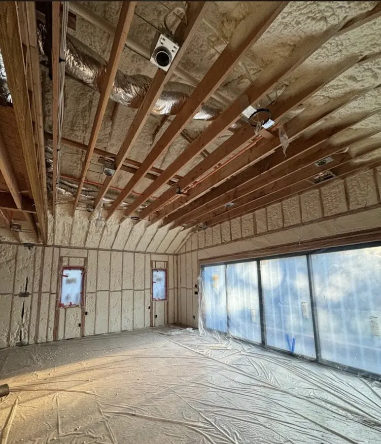 Interior walls and ceiling insulated with spray foam during new construction in White Hall
